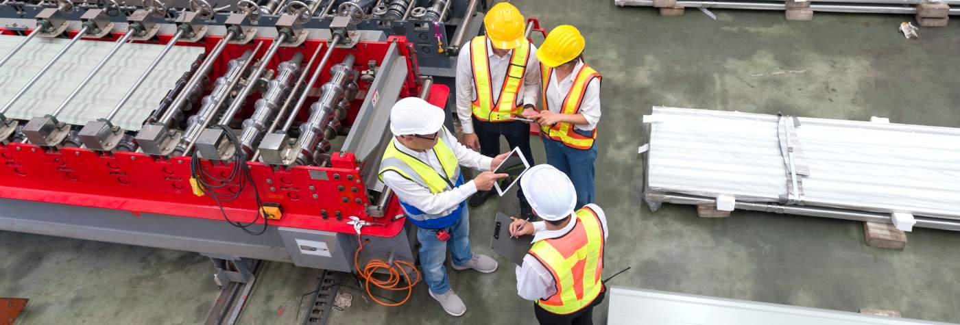 engineers in a metal sheet factory